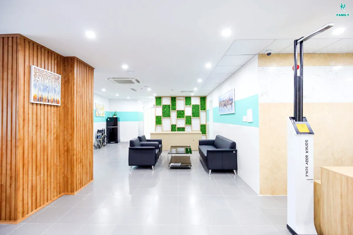 A waiting area at Family Hospital in Da Nang, with sofas and a wall of plants