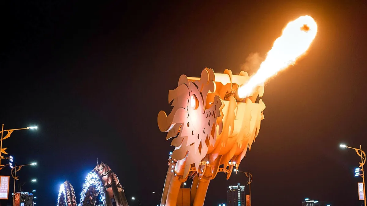The dragon head of the Dragon Bridge breathing fire over the Han River at night